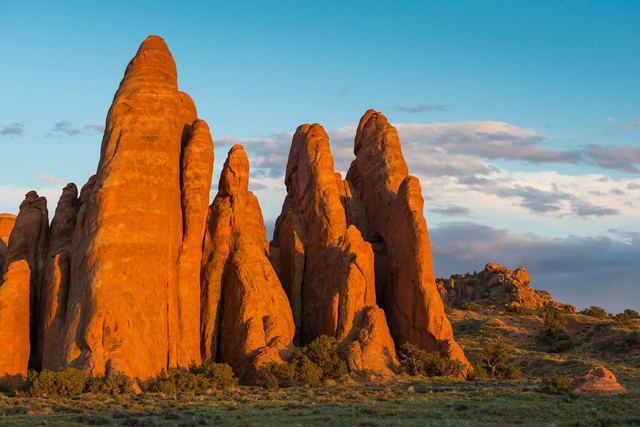 Red sandstone fins glow in sunset lighting